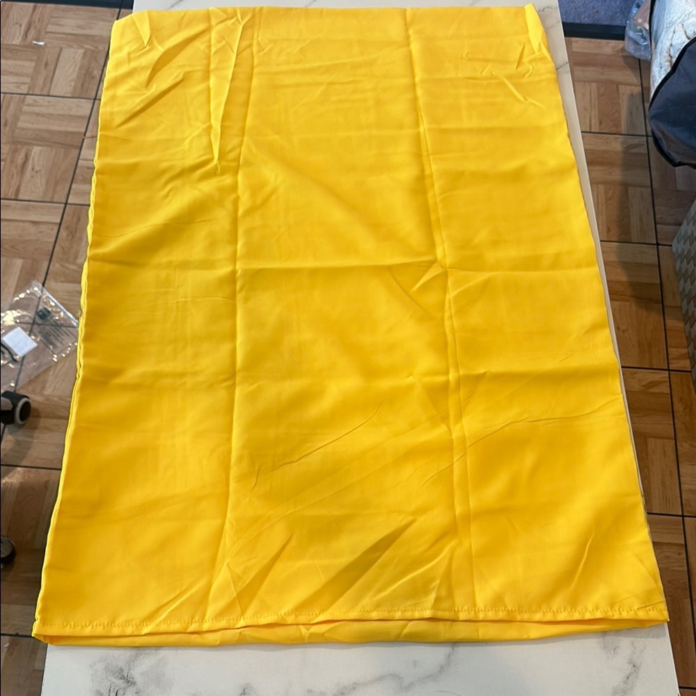 One new in bag yellow queen size pillow case